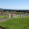 A sweeping view of the valley and Mt. Hood with manicured lawns, paths, flower gardens and balcony.